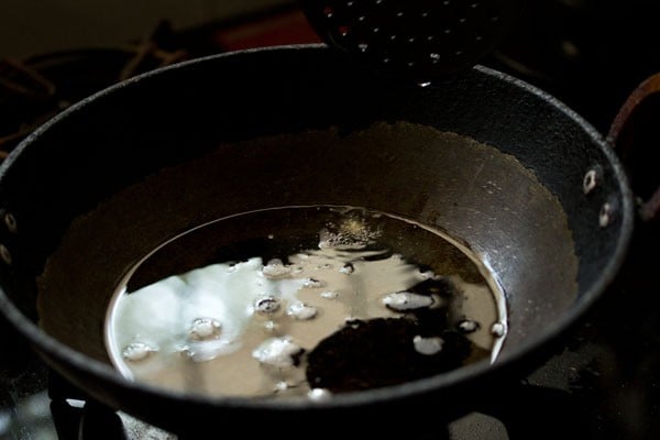 heating oil in kadai for frying