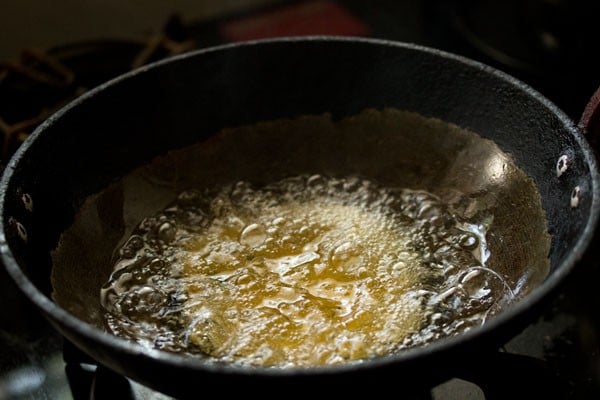 methi puri added to hot oil