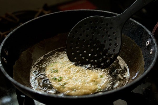 frying methi puri in oil