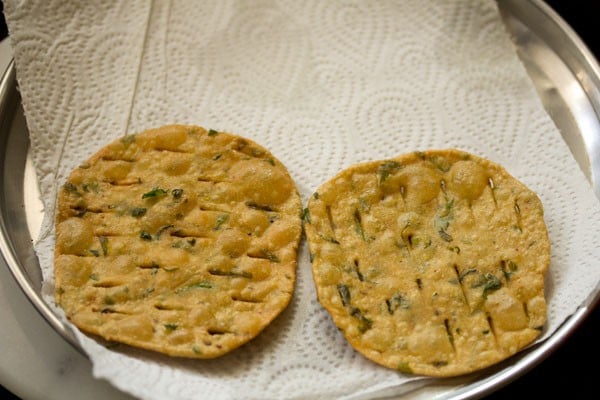 fried methi puri on kitchen paper towels