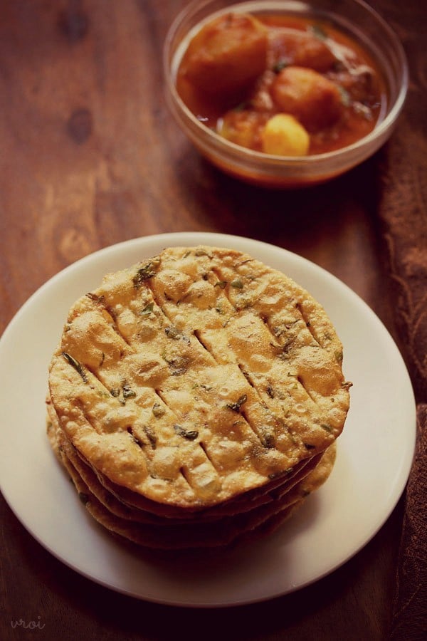 methi puris served on a white plate