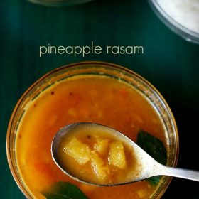 pineapple rasam in a spoon on top of bowl filled with pineapple rasam