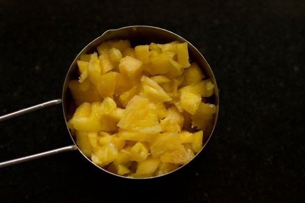 chopped pineapple in a cup