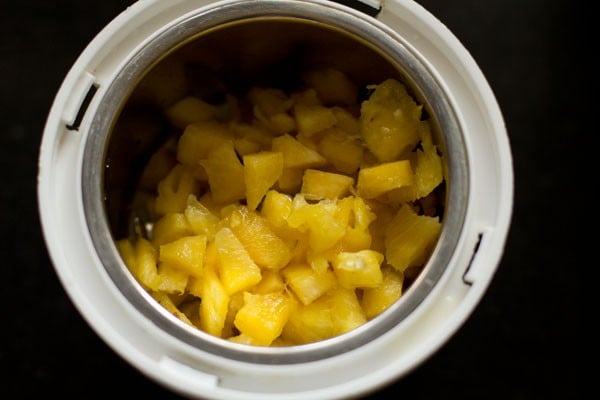 chopped pineapple cubes in blender jar