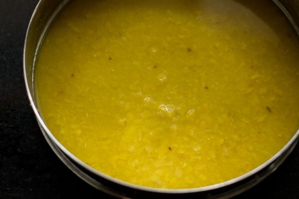 mashing cooked tuvar dal