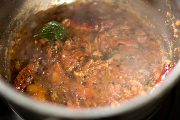 sautéing crushed tomatoes in pan