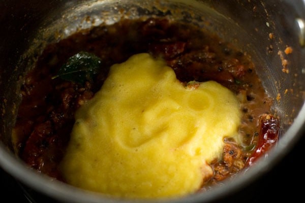 adding pineapple puree to pan