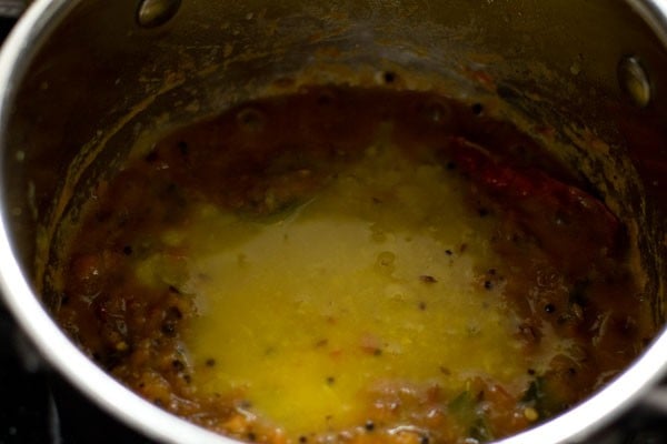 adding cooked, mashed dal to pan