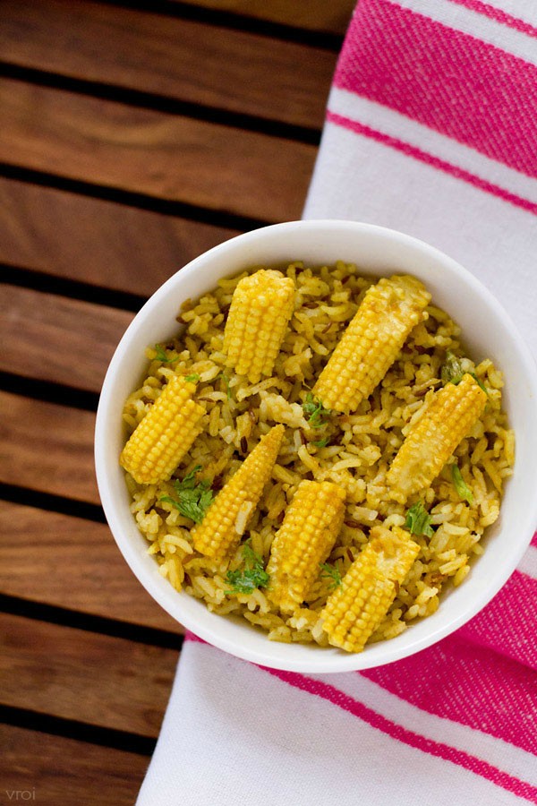 baby corn pulao served on a white bowl