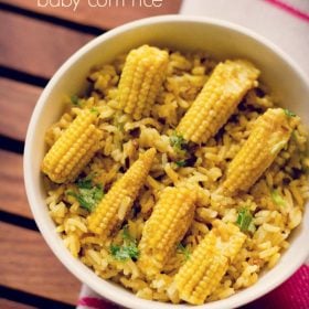 baby corn rice garnished with coriander leaves and served in a white bowl.