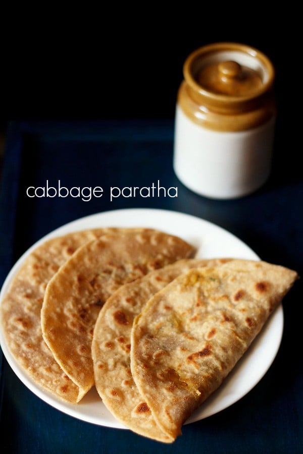 cabbage paratha served on a white plate with text layover.