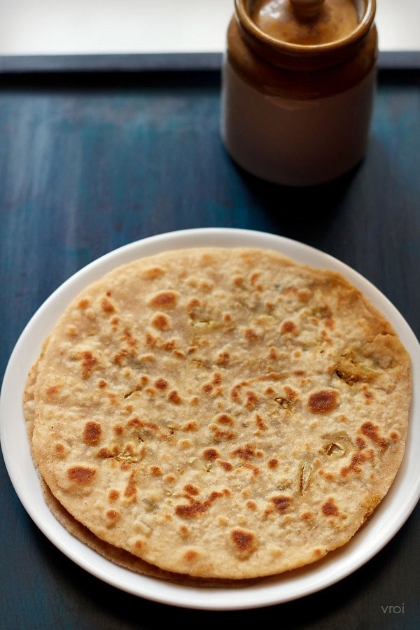 cabbage paratha served on a white plate