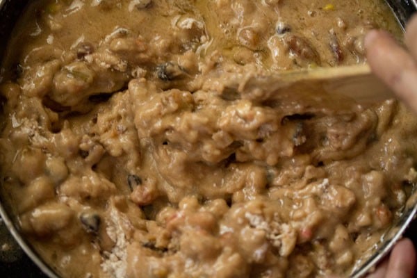 batter being folded with a wooden spatula