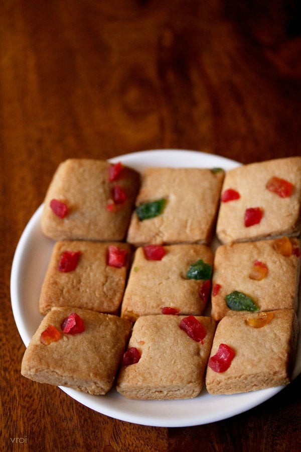 fruit biscuits or tutti frutti cookies served on a white plate. 