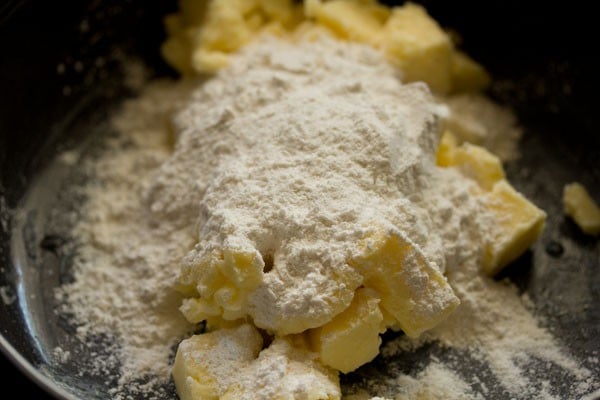 powdered sugar added to the softened butter in the bowl. 