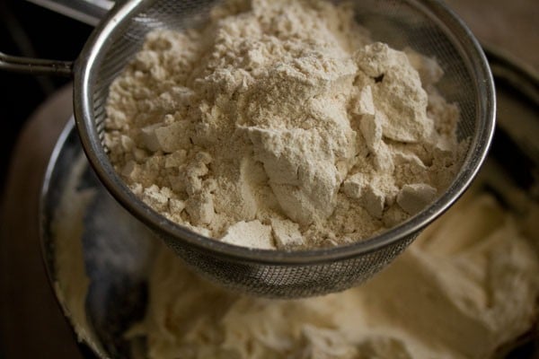 sifting whole wheat flour directly into the creamed butter-sugar mixture. 