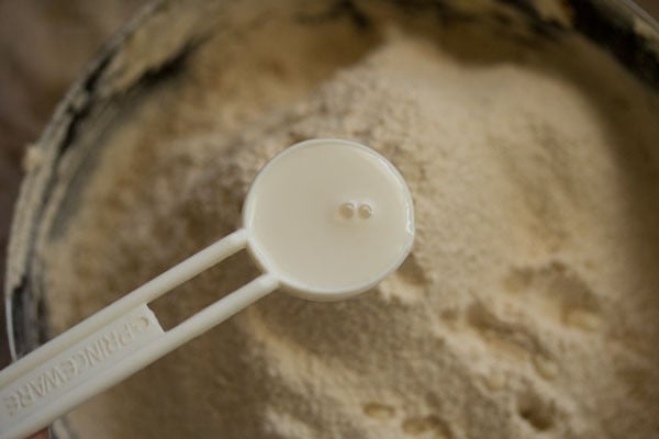 milk added to the flour mixture in the bowl. 