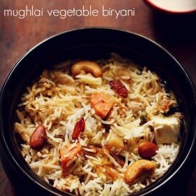 mughlai biryani served in a black handi with a bowl of raita placed in the background and text layover.