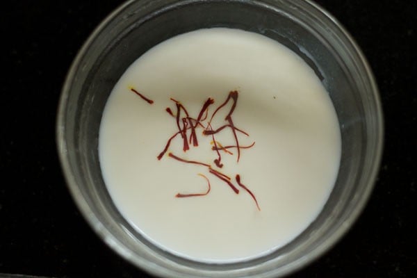 saffron strands soaked in warm milk