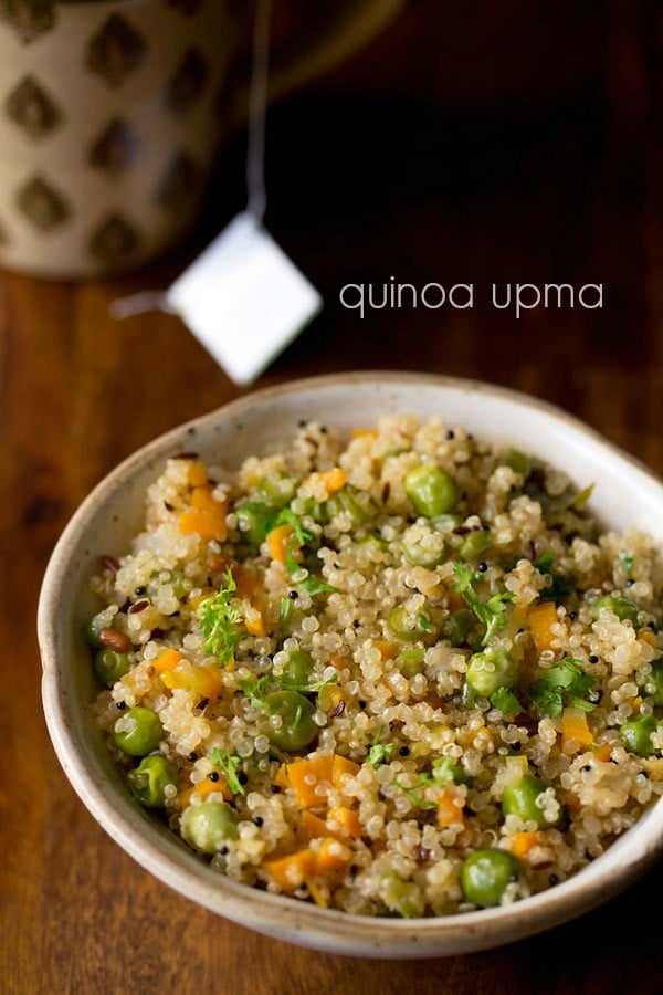 closeup shot of quinoa upma in a ceramic bowl with text layovers