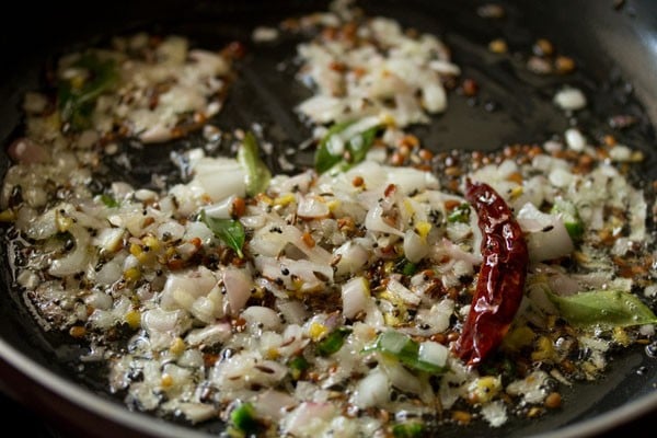 onions getting sautéed in pan