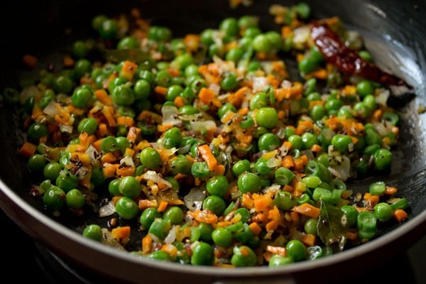 sautéing veggies in pan