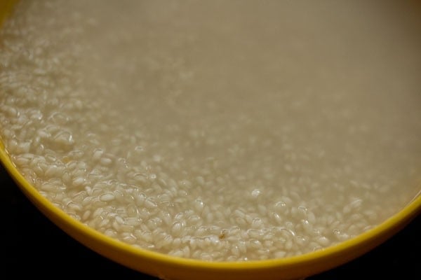 rinsing the parboiled rice