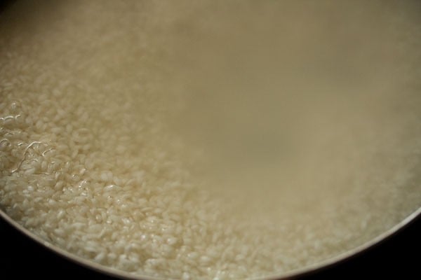 soaked parboiled rice in a bowl