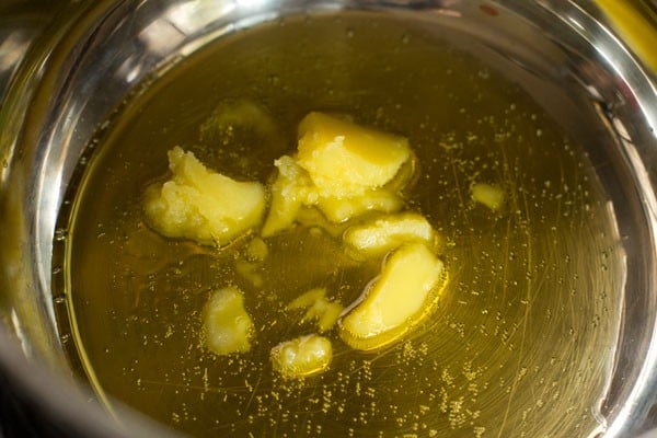 heating ghee in a deep thick bottomed pan. 
