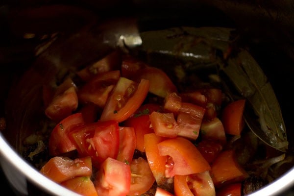 chopped tomatoes added to the onion mixture. 