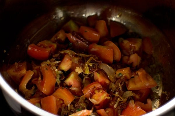 sautéing tomatoes with the onion mixture. 