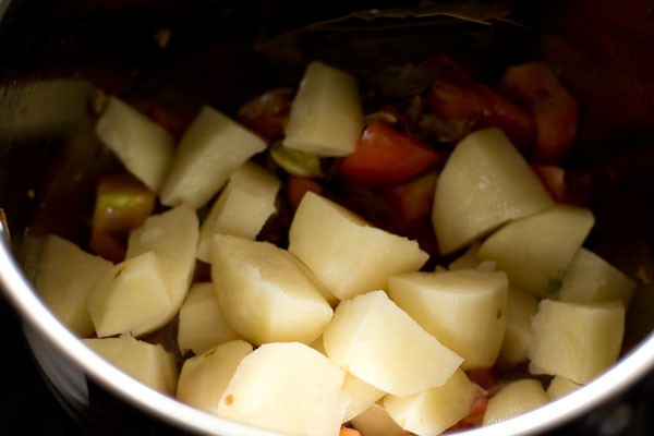 diced potatoes added to the onion-tomato mixture. 