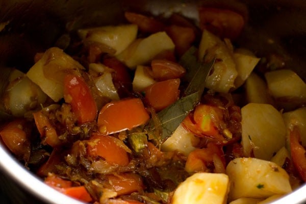 sautéing potatoes with the onion-tomato mixture. 