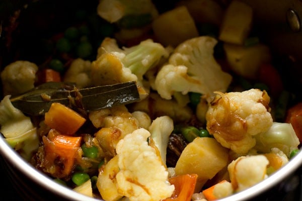 vegetables mixed with the rest of the ingredients in the pan. 