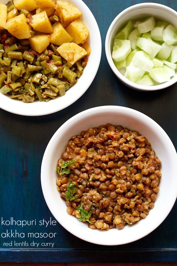 akkha masoor garnished with coriander leaves and served in a white bowl.