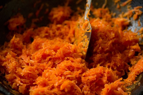 sautéing carrots by stirring frequently. 