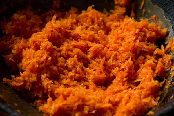 sautéing carrots for making carrot burfi. 