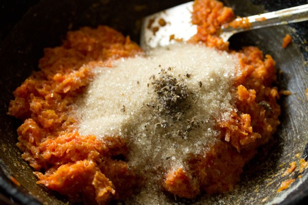 sugar and cardamom powder added to the carrot mixture. 