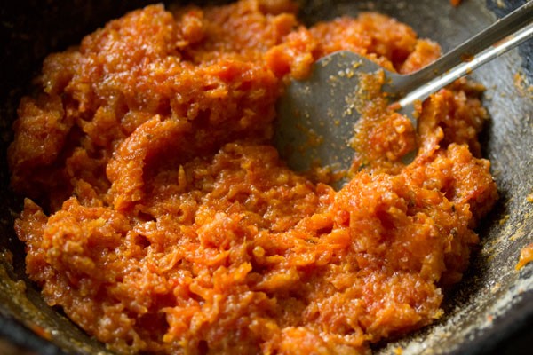 mixing sugar and cardamom powder well with the carrot mixture. 