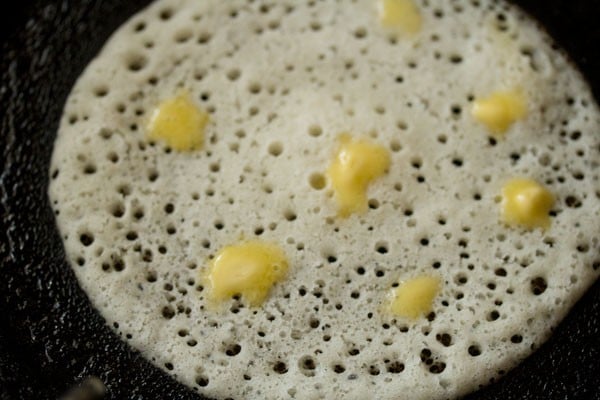 butter added to davangere benne dosa on tawa