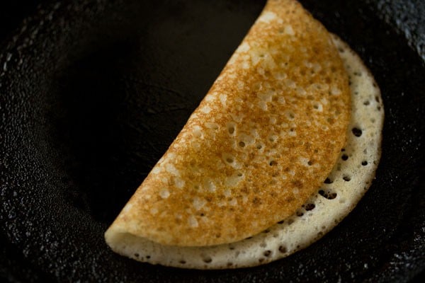 cooked and folded davangere benne dosa on tawa