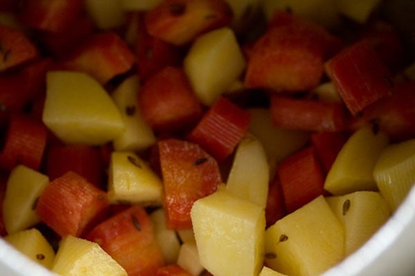 chopped carrots and chopped potatoes added in the pressure cooker. 