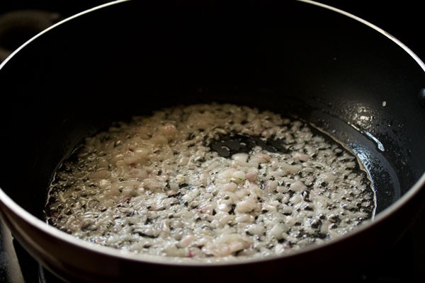 sautéing onions in the wok. 