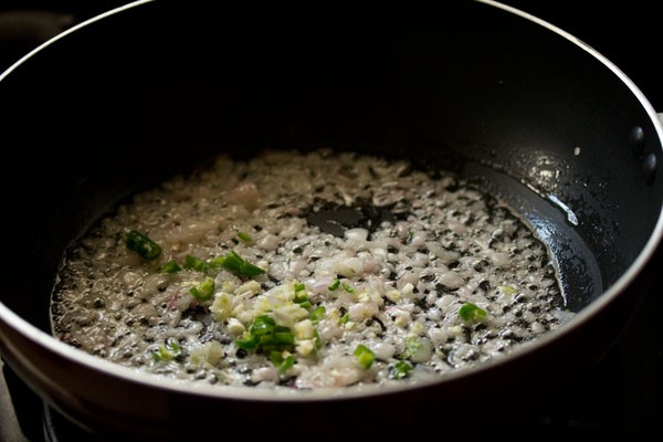 sautéing chopped green chilies, finely chopped garlic and finely chopped celery in the wok. 
