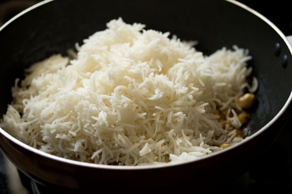 cooked basmati rice added in the wok. 