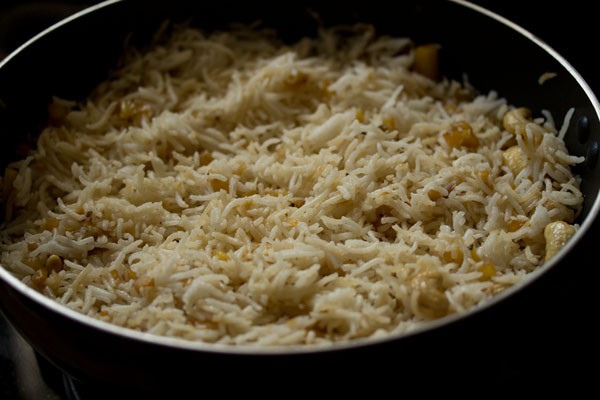 sautéing the rice mixture in the wok. 