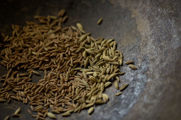 cumin seeds and fennel seeds in the pan