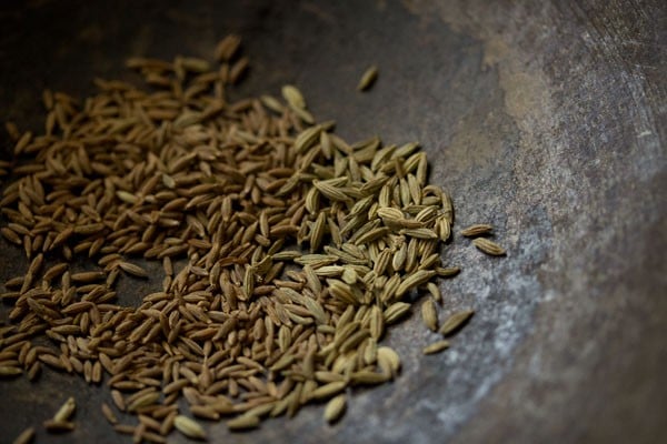 cumin seeds and fennel seeds in the pan