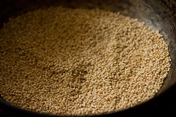 roasting sesame seeds for making sesame laddu. 