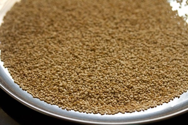 roasted sesame seeds on a plate for making sesame laddu. 